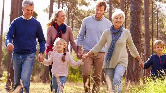Family walking together in the woods