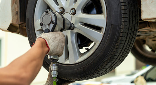 Mechanic changing car wheel