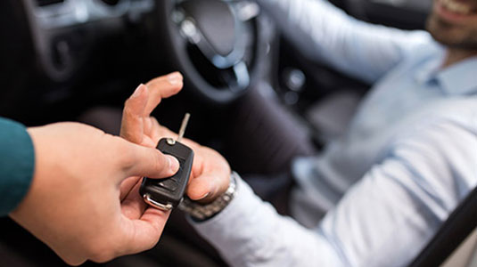 Man receiving car keys