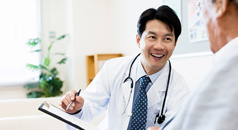 Doctor explaining records to a senior patient