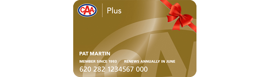 A CAA Plus Membership card with a red bow wrapped around the top right corner.