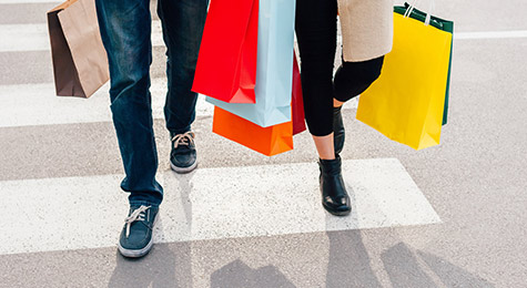 A couple with lots of shopping bags.