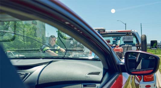 CAA truck driver towing car