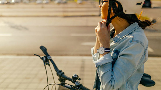 Woman on bike wearing helmet