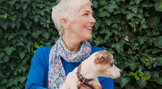 Woman holding dog