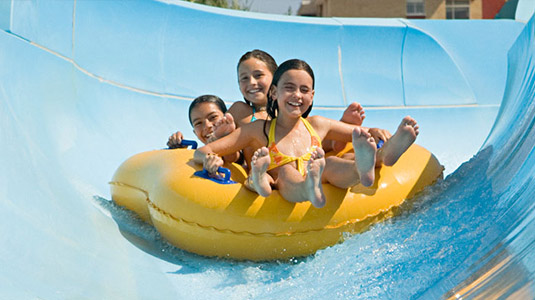 Kids going down waterslide at Wild Waterworks