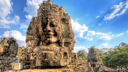 Ancient stone face tower beneath the blue sky