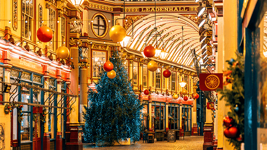 Illuminated Christmas tree at Leadenhall Market at night, London, England, UK