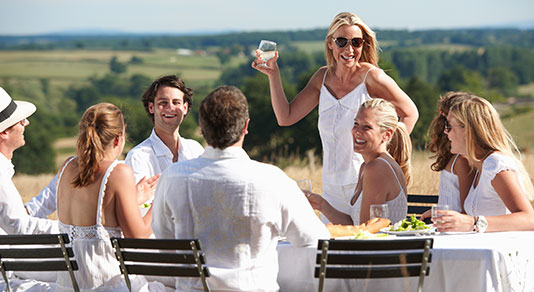 Friends having a meal in a destination wedding