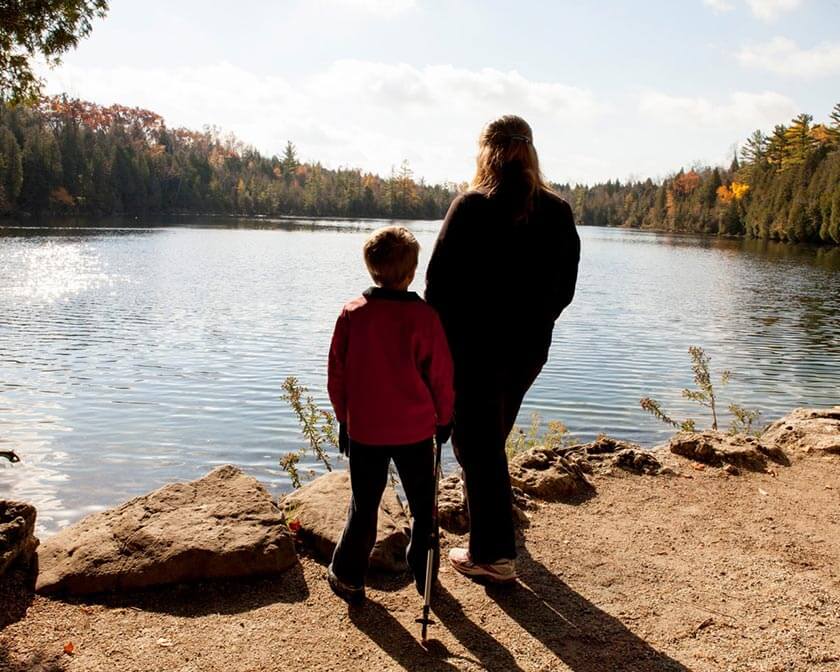 Mom and son looking out into Crawford Lake