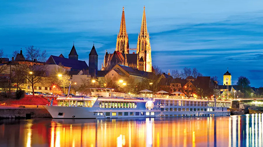 Cruise ship passing by an old town in Germany.