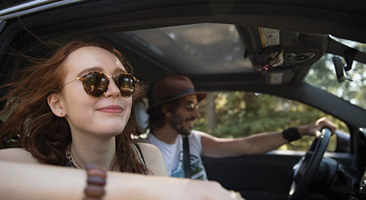 Woman enjoying a road trip