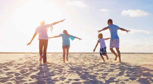 Family having fun on a beach.
