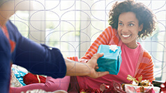 Couple opening holiday gifts