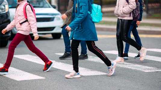 Students crossing the street to get to school