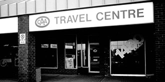 Black and white photo from 1961 showing the storefront of a CAA Travel Centre