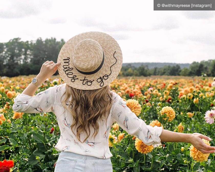 Woman looking out into a field of flowers